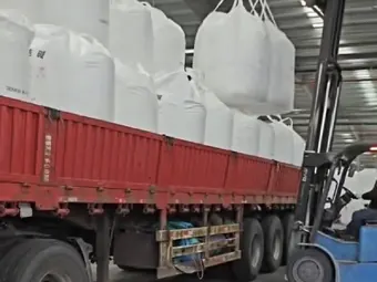 Forklift loading a bulk bag onto the truck